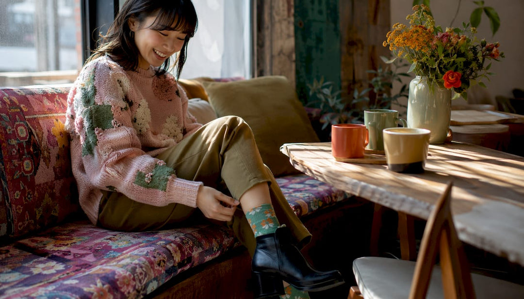 Woman adjusting socks with stylish outfit