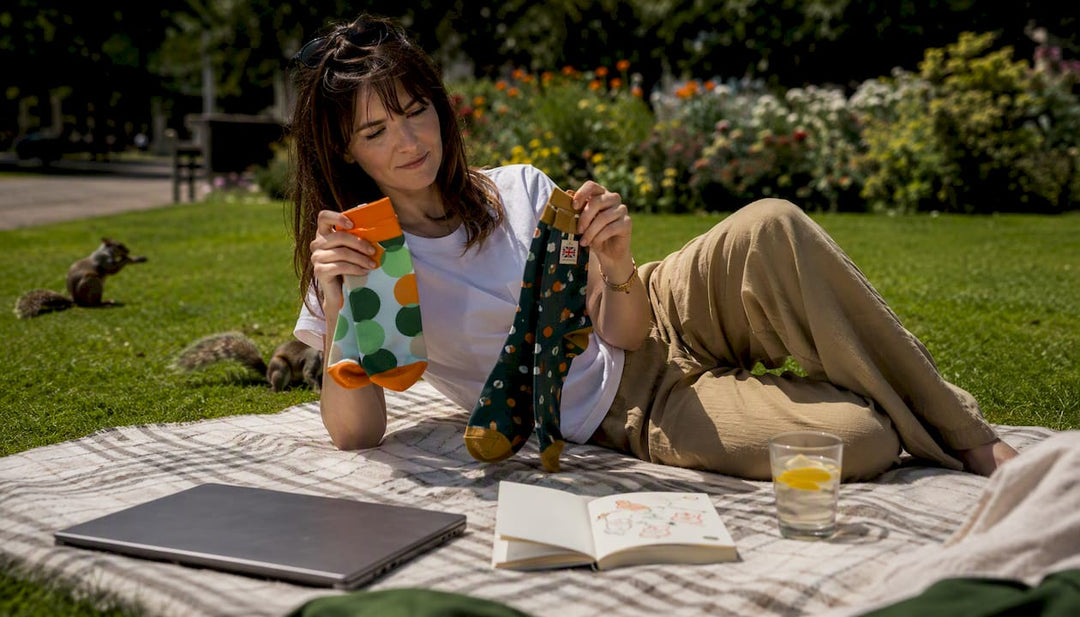 Woman comparing socks at home for UK sock brand choices
