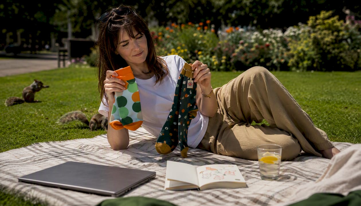 Woman comparing socks at home for UK sock brand choices